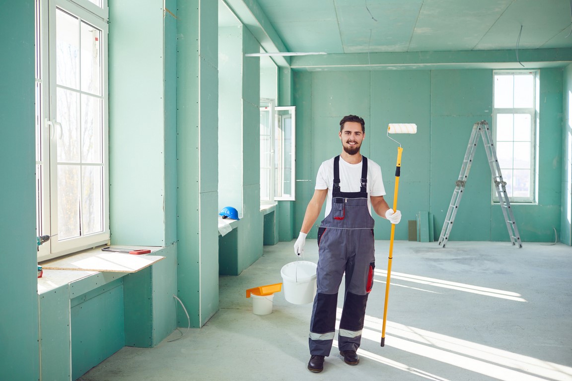 Bearded painter construction worker on a construction site. reforms houses in Xabia